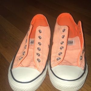 Bright orange low top converse